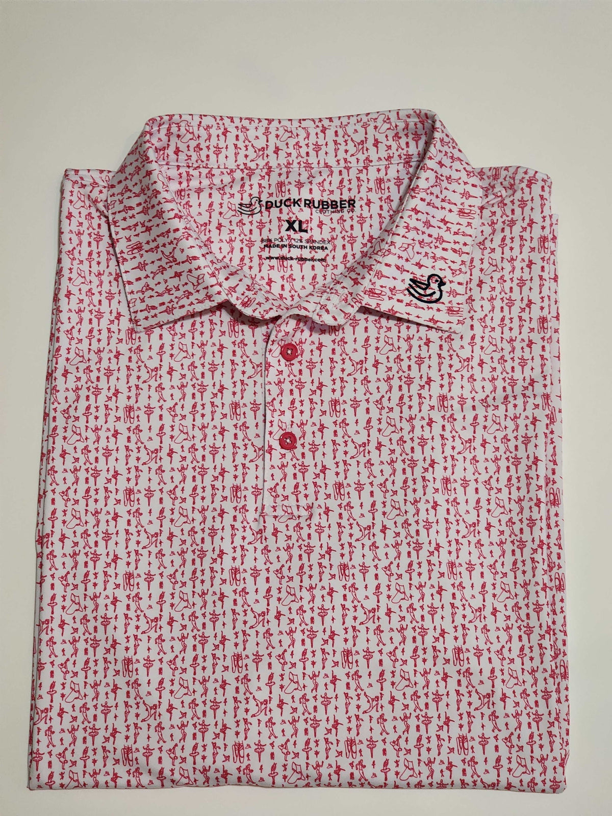 White polo shirt with red micro-print and duck logo, celebrating The Girl Dad Tiny Dancer theme